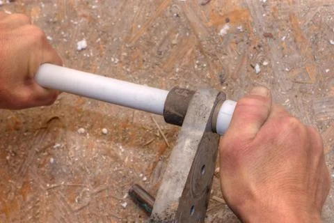 Polypropylene pipes welding, hands working close up. Stock Photos