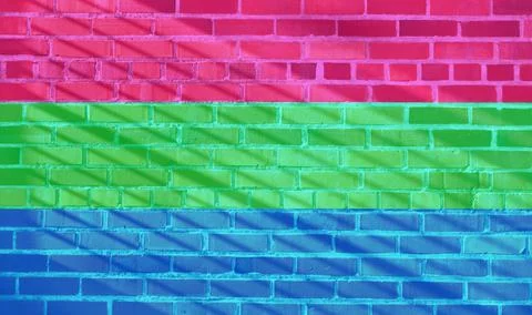 Polysexual Flag projected on a sunny brick wall background Ilustração Stock