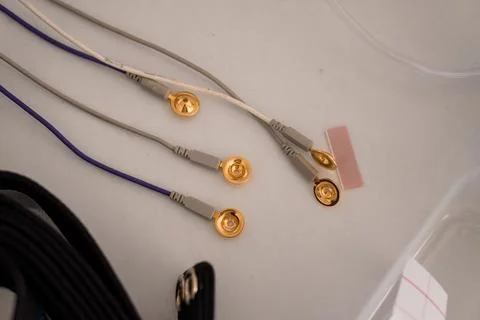 Polysomnography Setup Close-Up: EEG Electrode Connections on White Patient .. Stock Photos