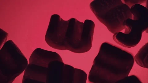 Polystyrene bits falling on the glass and hands touching and grabbing them. 4K Stock Footage 165497537