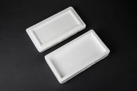 Polystyrene box on a black background for smartphone Stock Photos