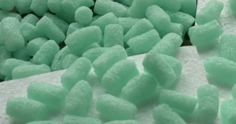 Polystyrene foam bead for packing. Plastic Styrofoam waste. Table spin. Stock Footage 280437169