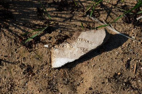 Polystyrene washed up on a sandy beach. Stock Photos