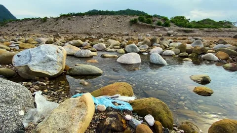 Polythene Plastic Waste Polluting Rocky Mountain River Stream Nature at a Video stock 341014575