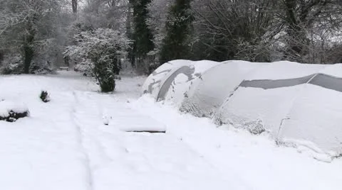 A polytunnel covered in snow Stock Footage 20493693