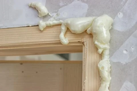 Polyurethane foam around the door frame Stock Photos