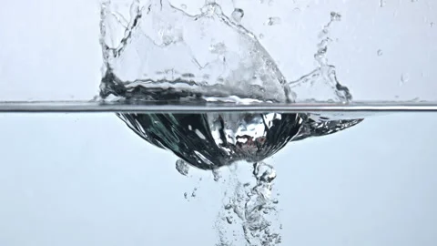 Pome fall splashed water goblet closeup. Sparkling clear aqua with organic apple Stock Footage 219269934