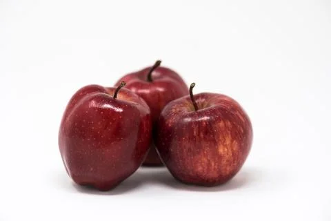 Pome fruit, three red apples on white background Stock Photos