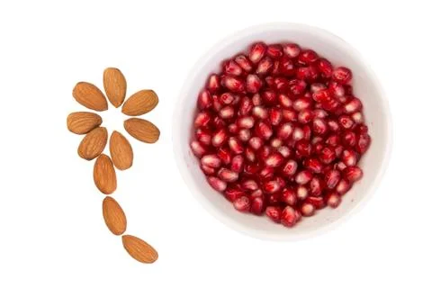 Pomegranate with almonds Stock Photos