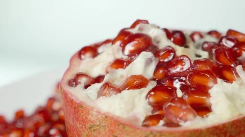 Pomegranate and grains on a rotating table Stock Footage 100550440
