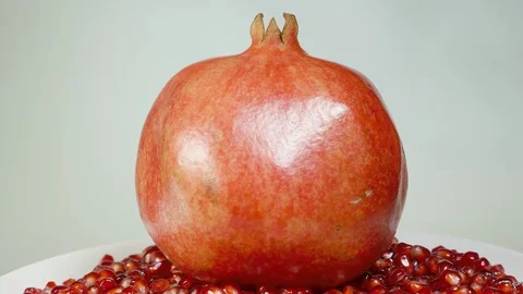 Pomegranate and grains on a rotating table Video stock 100551141