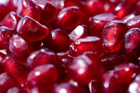 Pomegranate arils pattern. Pomegranate grains texture. Fresh pomegranate arils Stock Photos