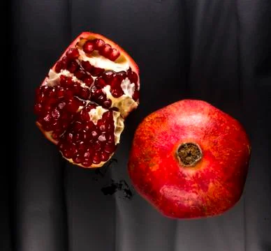 Pomegranate on black background Stock Photos