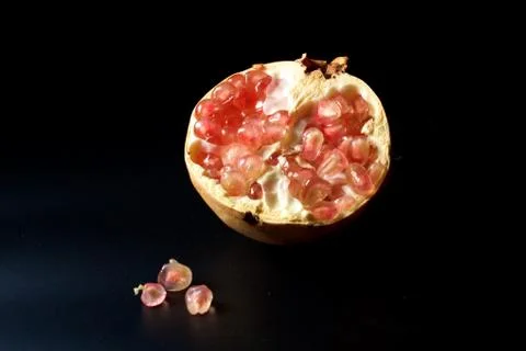 Pomegranate on black background Stock Photos