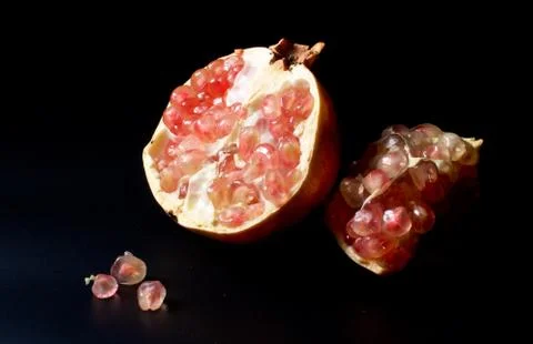 Pomegranate on black background Stock Photos