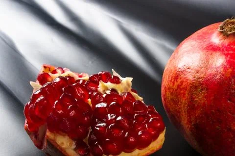 Pomegranate on black background Stock Photos