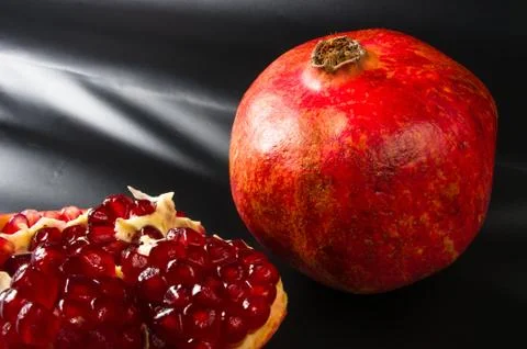 Pomegranate on black background Stock Photos