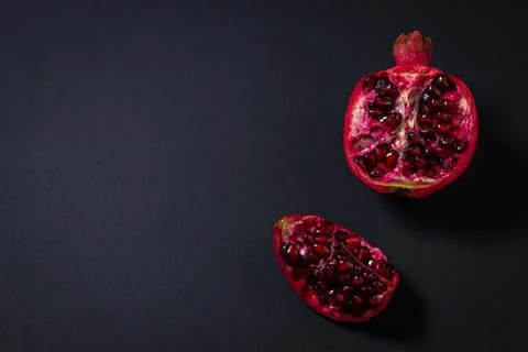 Pomegranate on a black background. Stock Photos