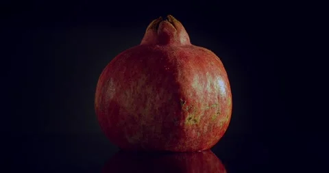 Pomegranate. Cut fruit with red inside. Roundshot circa 360 degrees. Stock Footage 221184430