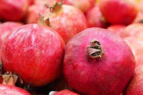 Pomegranate fruit background pattern. Whole pomegranate with flower. Fresh raw Stock Photos