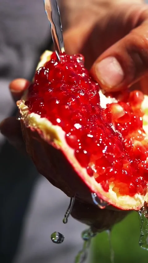 Pomegranate fruit close up vertical video. fresh harvested fruits and vegetables Stock Footage 277275449