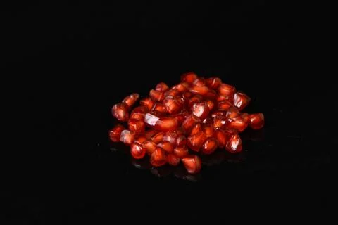 Pomegranate fruit on isolated black background Stock-Fotos