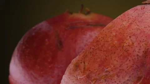 Pomegranate fruit macro shooting,isolated half kiwi on yellow background rotates Stock Footage 131602753