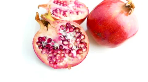 Pomegranate Fruit Rotating on White Background Above Shot Stock Footage 62322463