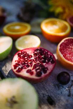 Pomegranate with fruit on the rustic table. Stock Photos