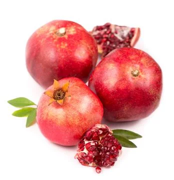 Pomegranate fruit with slice isolated on white background. Stock Photos