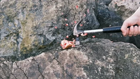 Pomegranate fruit is smashed with a hammer in a man hand, slow motion Stock Footage 165342925