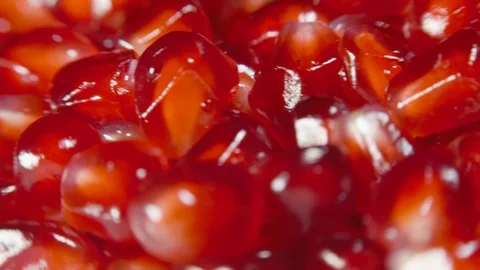 Pomegranate grains on a rotating table Stock Footage 100547335