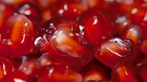 Pomegranate grains on a rotating table Stock Footage 100547663