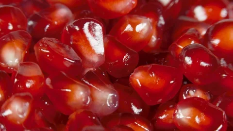 Pomegranate grains on a rotating table Stock Footage 100548957