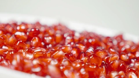Pomegranate grains on a rotating table Stock Footage 100549649