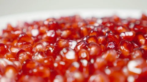 Pomegranate grains on a rotating table Video stock 100549975