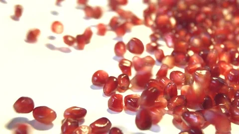 Pomegranate grains on a white background. Slow motion. Stock Footage 80246986