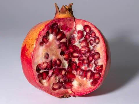 Pomegranate on a grey background Foto stock