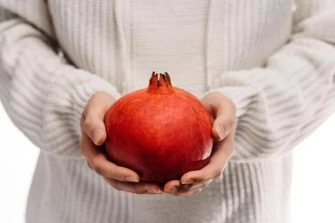 Pomegranate in hands Foto stock