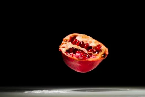Pomegranate, hovering in the air Stock Photos