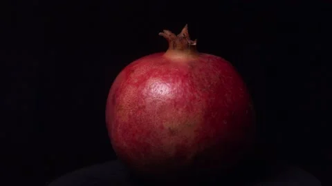 Pomegranate isolated rotating on a black background Stock-Footage 131028920
