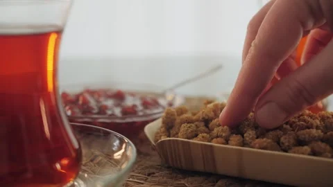 Pomegranate jam close-up on the table. Tea-drinking concept. Stock Footage 245831593