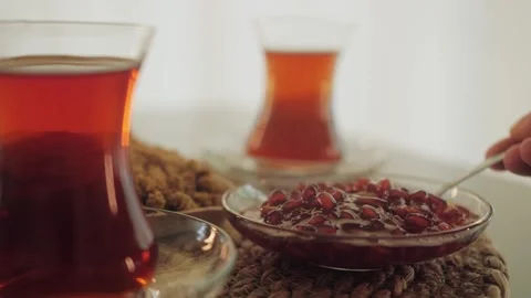 Pomegranate jam close-up on the table. Tea-drinking concept. Stock Footage 263887345