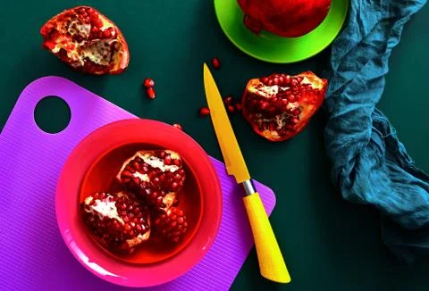 Pomegranate on a kitchen table Stock Photos