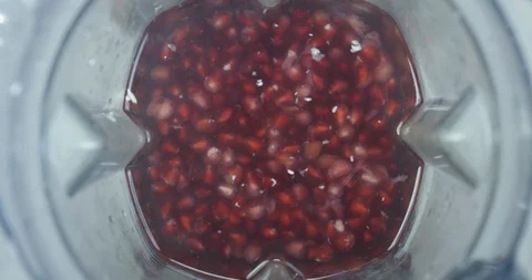 Pomegranate Preparing To Be Blended In Blender Shot from Inside  Stock Footage 114048779