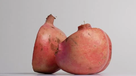 Pomegranate rotating on a kitchen table 스톡 동영상 249946941