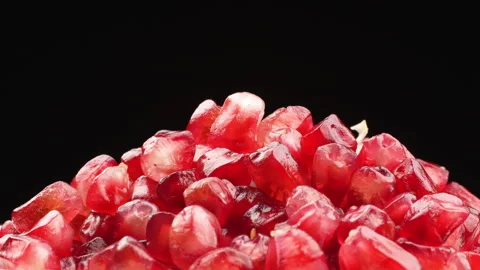 Pomegranate Seeds (Arils) Falling on Black Background Stock Footage 319959541