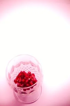 Pomegranate  seeds in crystal glass Stock Photos