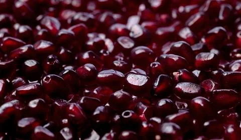 Pomegranate seeds macro texture background. Red ruby pomegranate arils clos.. Stock Photos