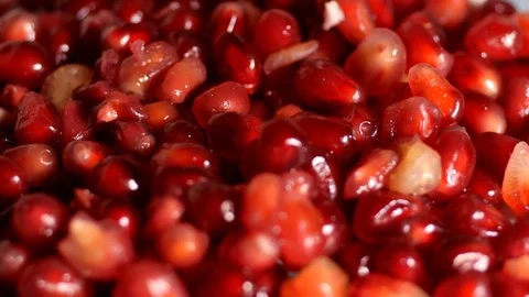 Pomegranate seeds, overhead Stock Footage 77343992